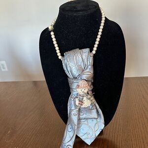 Elegant Gray and Blue Paisley Tie with Snowman Pin on a vintage faux pearl